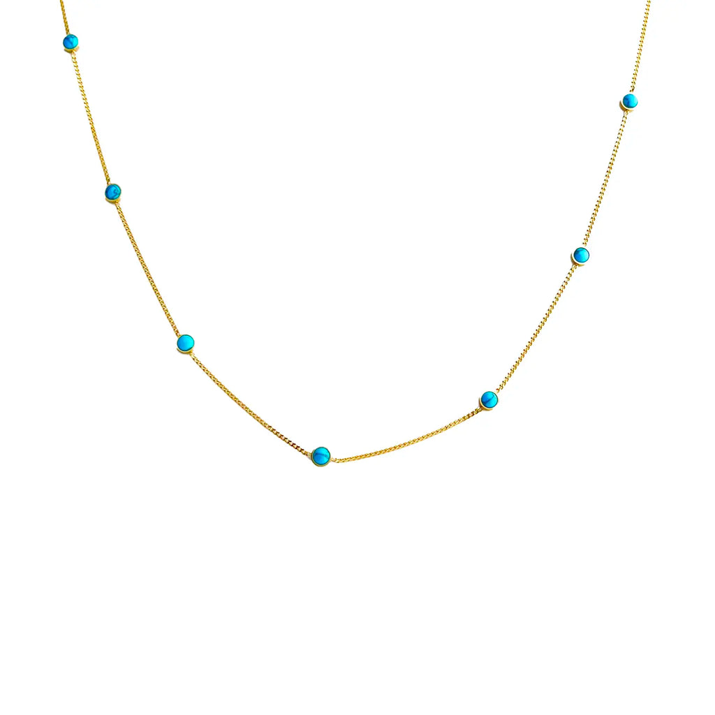 18k thin gold chain with natural turquoise stone beads spaced evenly along the chain.
