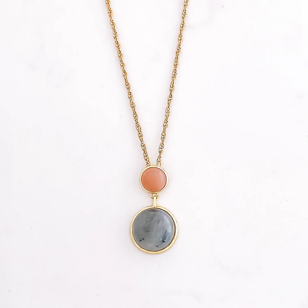 Natural labradorite stone pendant necklace. Two stone drop necklace, top stone is smaller and a coral color and the bottom stone is slightly larger with a blue-ish stone. plated with 18k gold chain and rims.