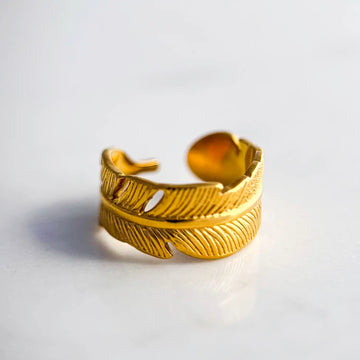 18k gold plated adjustable palm leaf ring. Ring engraved to represent a palm leaf.