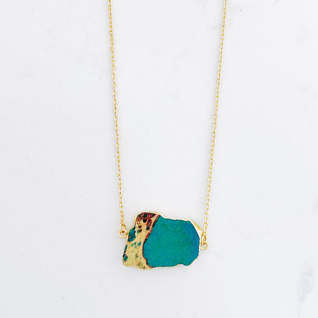 18k gold plated pendant necklace, pendant is a turquoise stone with gold/yellow accent in the stone similar to ocean and land rock meeting. Every necklace is unique.