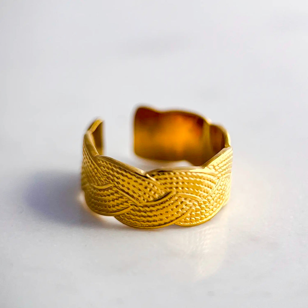 18k gold plated adjustable ring with a textured braid design.