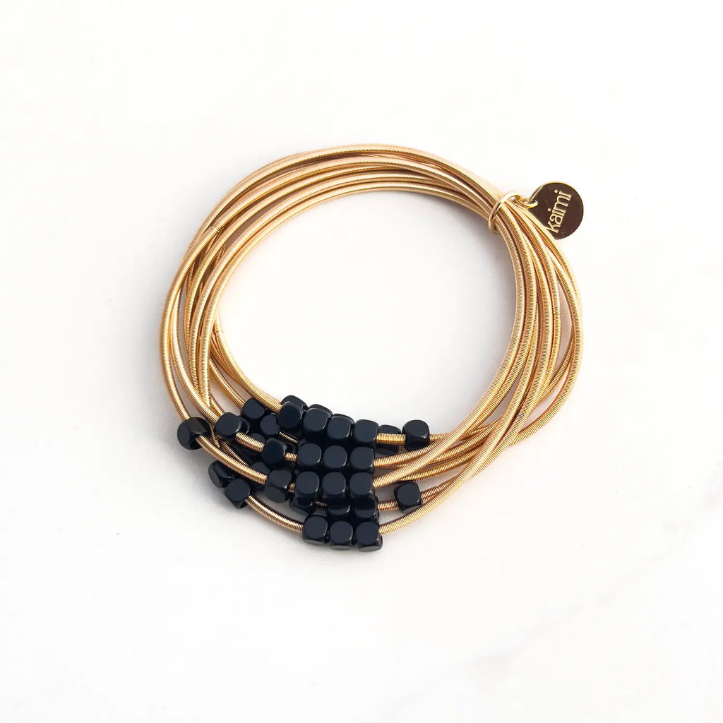 Stainless steel gold-plated stacked 8-wire guitar string bracelet with colored loose beads (black)