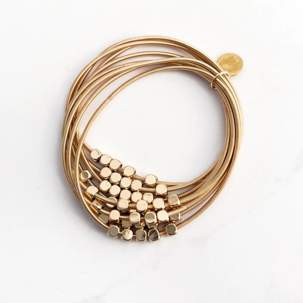 Stainless steel gold-plated stacked 8-wire guitar string bracelet with colored loose beads (gold)