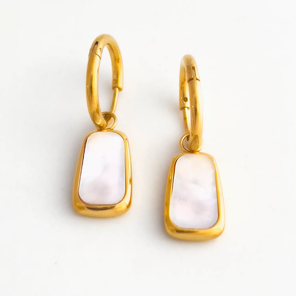 18k gold plated rectangular framed pearl drop earrings. The color of the pearl stone is white with a slight pink hue.