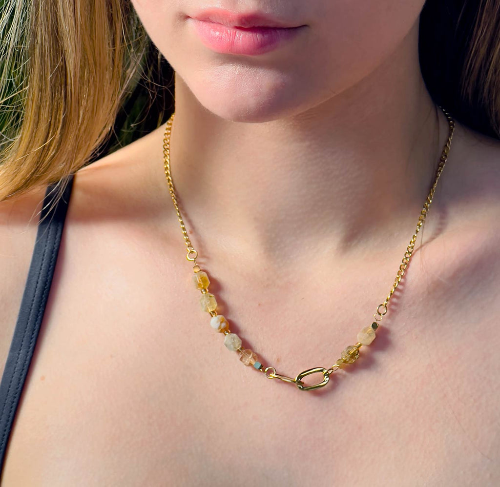 Girl wearing 18k gold plated chain and stone necklace with citrine stone beads.