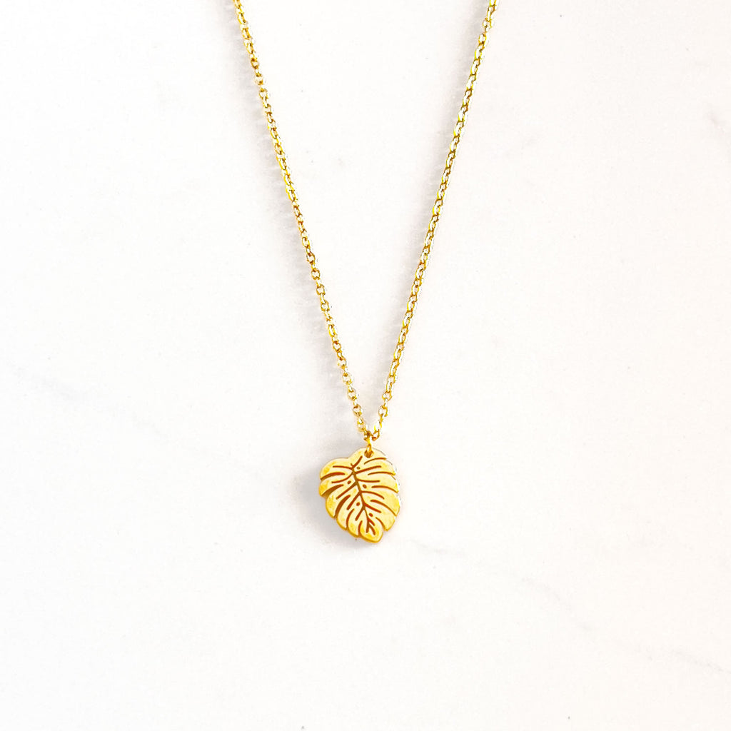 18k gold plated monstera palm leaf pendant necklace with cable chain.