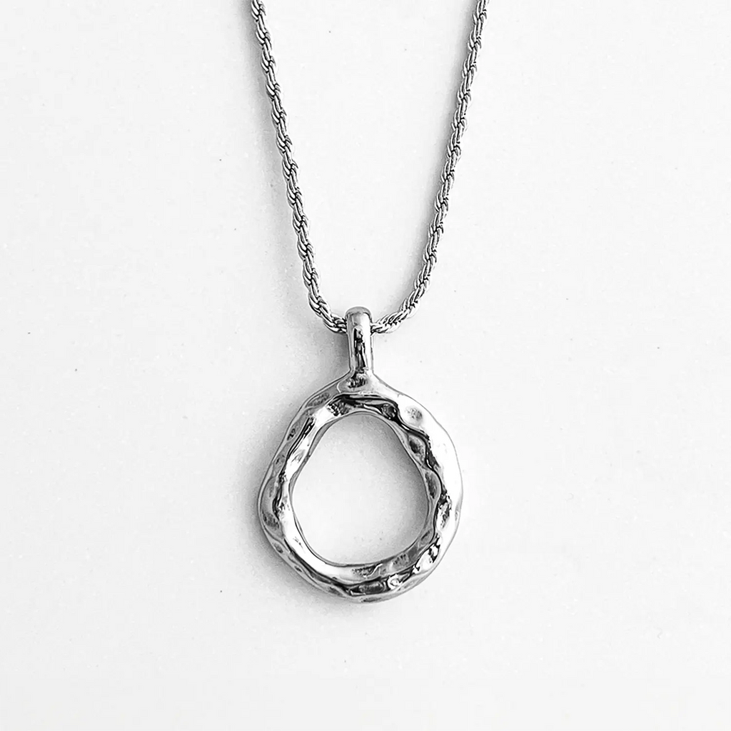 Silver color stainless steel pendant necklace, pendant is a slightly mishapen circle. (abstract "O" pendant)