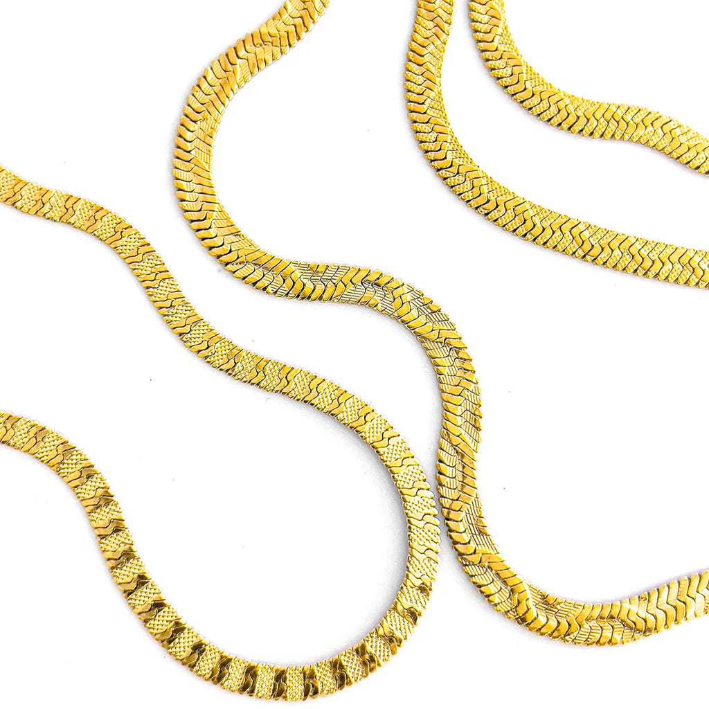 2 types of the 18k gold-plated snake textured chain necklace. Each chain has a different snake pattern.