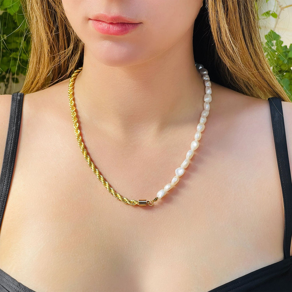 Girl wearing Mixed media half and half pearl and chain necklace. Half 18k gold textured thick chain, other half white fresh-water pearl. Worn with black bikini top.