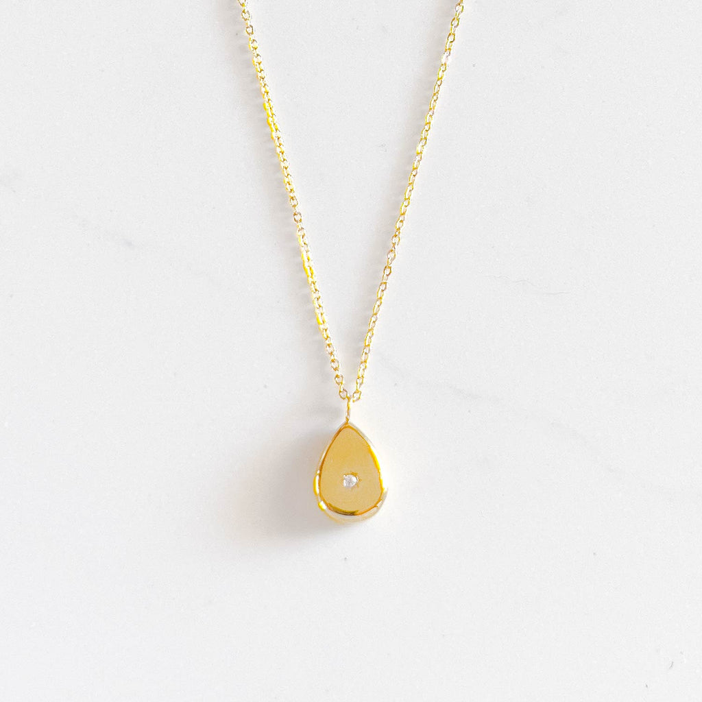 18k gold plated pendant necklace.small water drop pendant with a small stone in the middle.