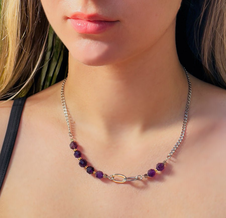 Girl wearing Silver color stainless steel bead and chain necklace with amethyst purple beads.